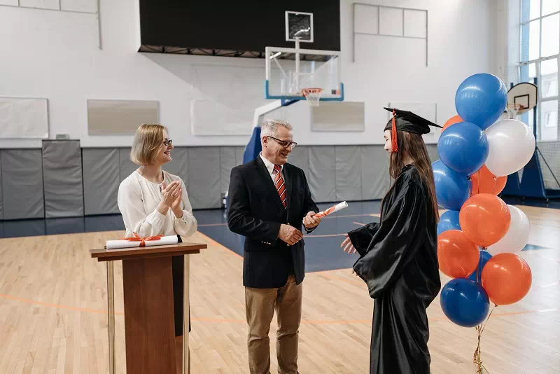 Receiving the Diploma